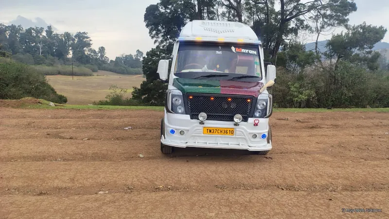 Front view of the Mayon Traveller vehicle on a hillside road
